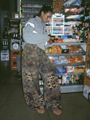 GKIKZ DISTRESSED LEOPARD WIDE-LEG DENIM