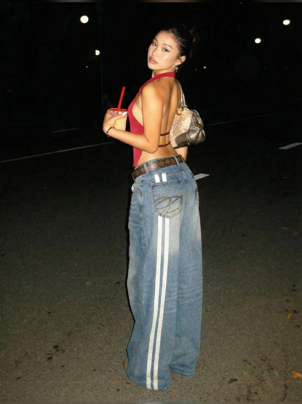 GKIKZ customer wearing washed wide-leg jeans
