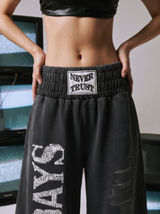"Never Trust" Wide-Leg Pant