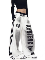 GKIKZ X RVNTENG™ GRAPHIC STRIPE WIDE-LEG TRACK PANTS