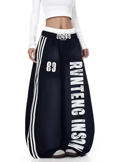 GKIKZ X RVNTENG™ GRAPHIC STRIPE WIDE-LEG TRACK PANTS